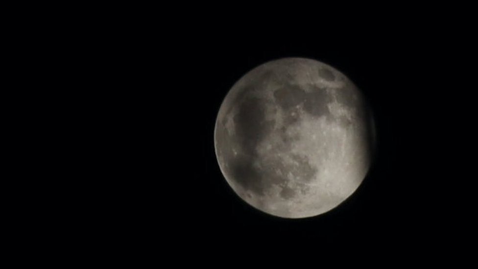 The moon is seen during a penumbral lunar eclipse on November 30, 2020 in Beijing, China.