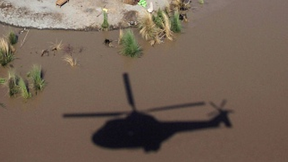 Pakistan floods: Helicopter lifts stranded boy