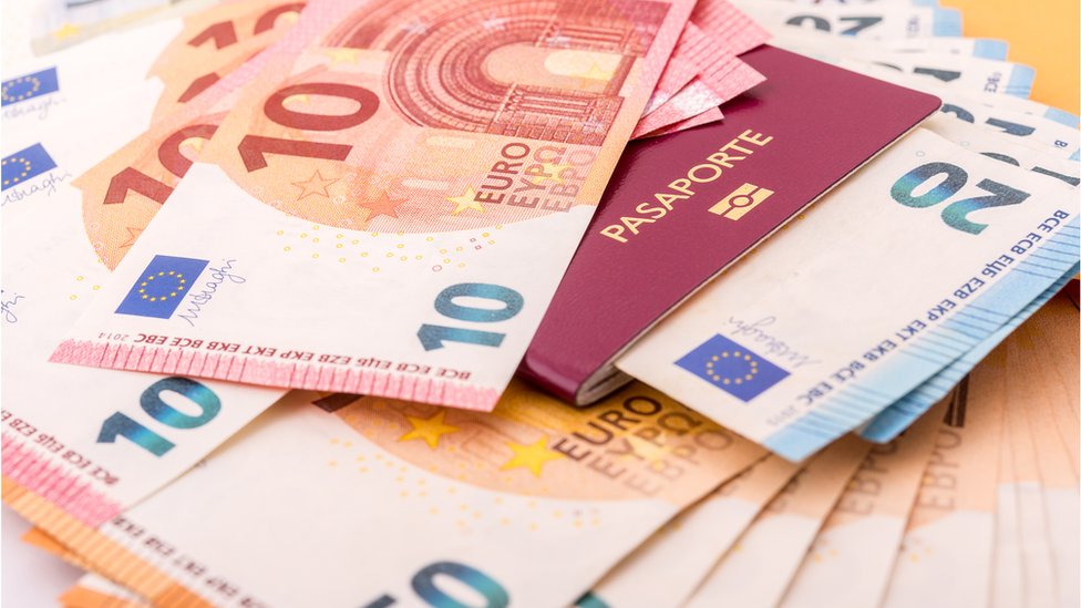 A stock photo of a passport and euros