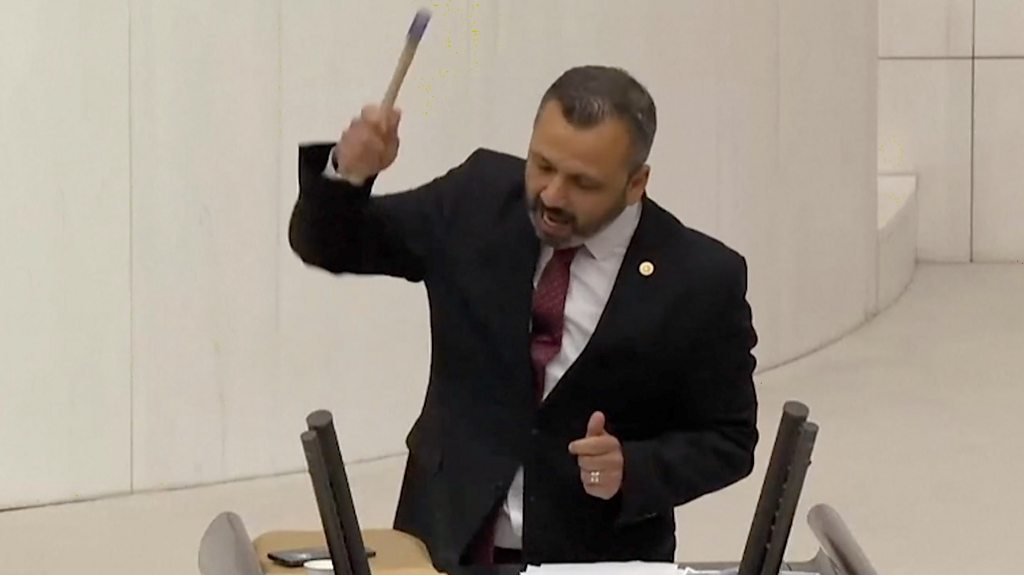 Watch: Turkey MP smashes phone with hammer in parliament