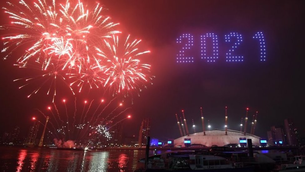 Fireworks and drones illuminate the sky in London