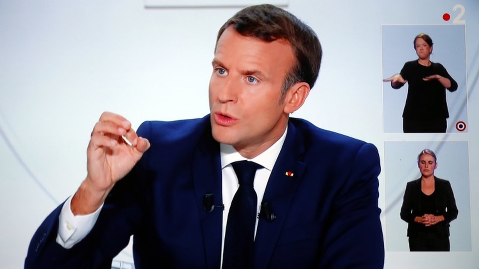 French President Emmanuel Macron announced a curfew in nine cities in a televised interview on Wednesday
