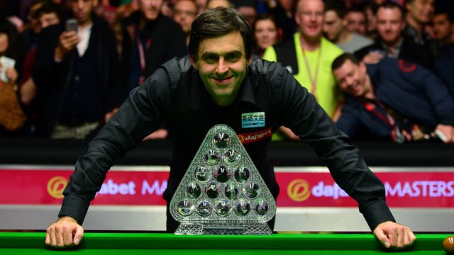 Ronnie O'Sullivan poses with the Masters trophy after winning the 2016 final against Barry Hawkins
