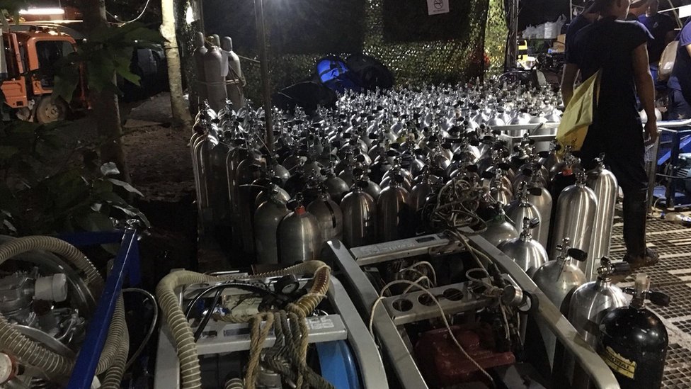 Oxygen tanks prepared for divers outside the cave complex