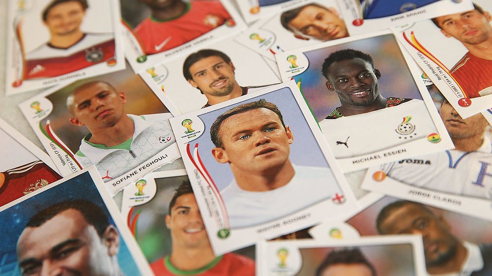 A number of Panini World Cup 2014 stickers including England's Wayne Rooney - pictured in a plain white shirt due to licensing issues
