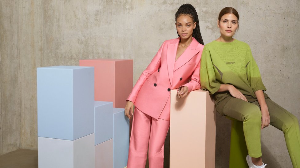 Two models wear Zalando products, a pink and green suit