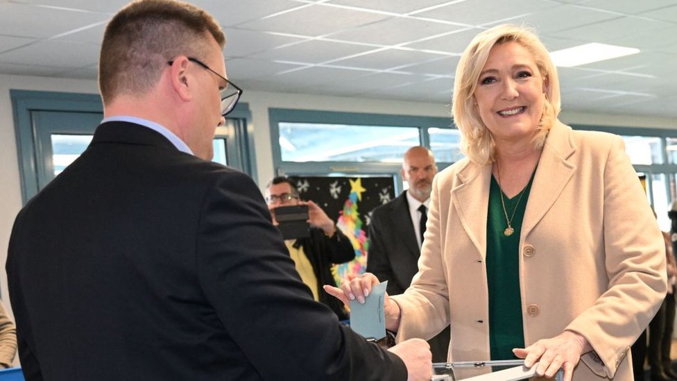 French far-right party Rassemblement National (RN) presidential candidate Marine Le Pen casts her ballot for the first round of France's presidential election at a polling station in Henin-Beaumont