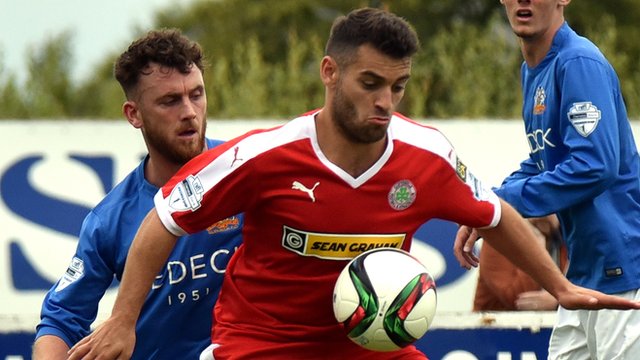 Cliftonville's David McDaid in action against Glenavon