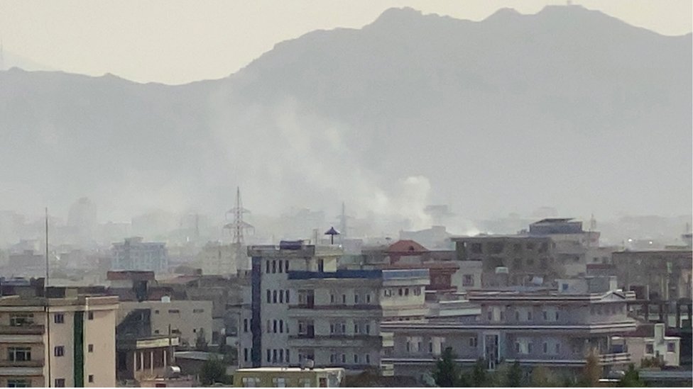 Smoke billows at the scene following an explosion near the Hamid Karzai International Airport in Kabul, Afghanistan, 29 August 2021