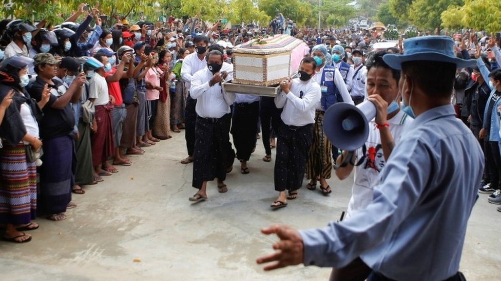 People in Myanmar line the streets to mourn a slain protester