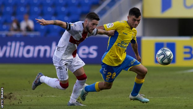 Pedri (r) making his professional debut for Las Palmas in August 2019 in a second tier defeat by Huesca