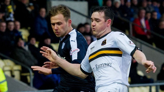 Dundee's Greg Stewart in action against Dumbarton's Mark Docherty