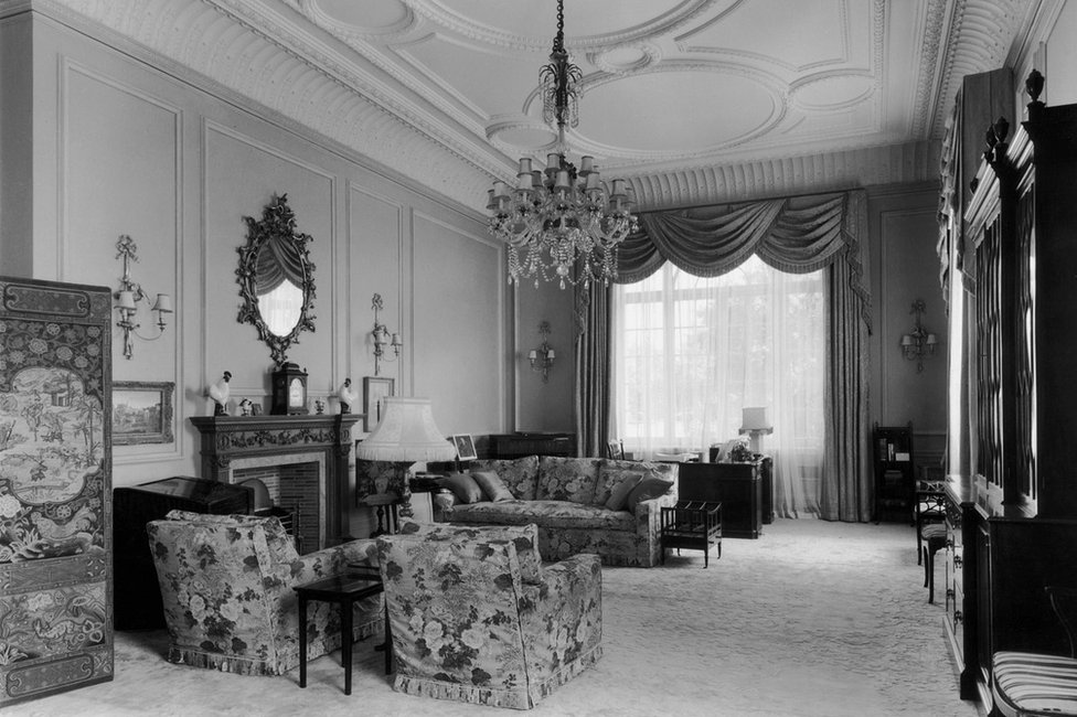 Princess Elizabeth's sitting room on the first floor of Clarence House in London, 1949. The house was built in 1825-27 by John Nash for the Duke of Clarence, later King William IV. There are Chippendale and Sheraton pieces amongst the furniture and the ceiling is a Nash original.