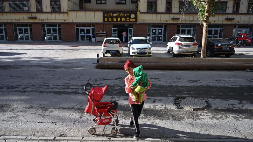 A woman and a child in Aksu, Xinjiang