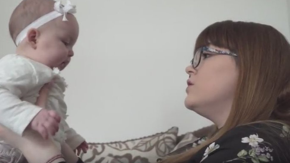 sleeping with baby on chest on couch