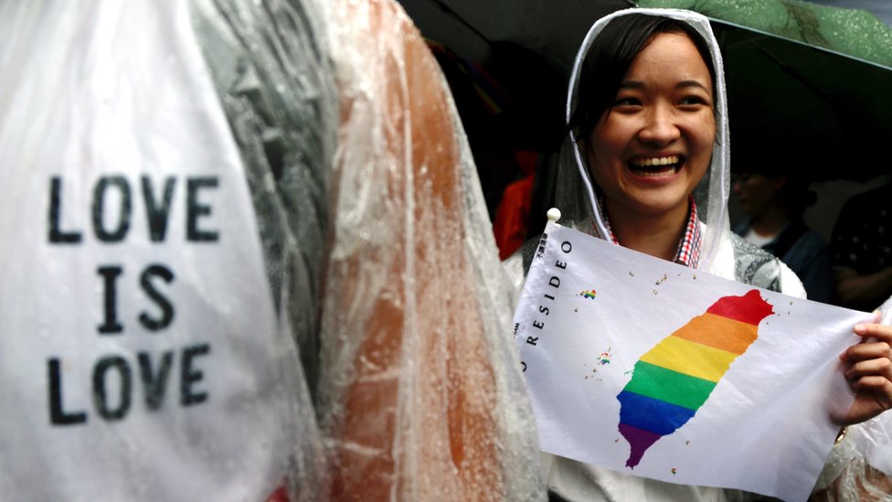 Supporters of same-sex marriage gather outside the parliament building as a bill for marriage equality is debated by parliamentarians in Taipei, Taiwan, 17 May 2019.