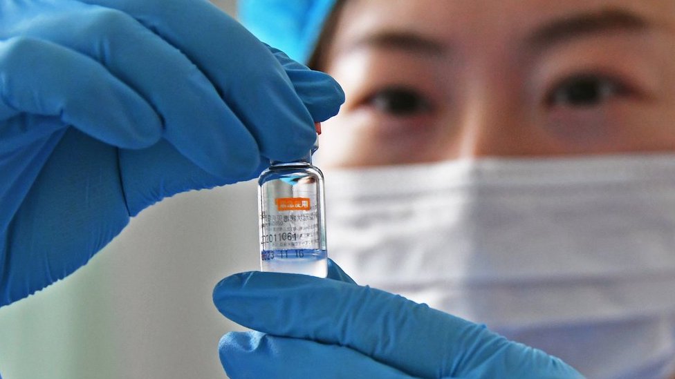 A medical worker checks a dose of Sinovac Biotech vaccine against the COVID-19 coronavirus disease at a community health station in Yantai, east China's Shandong province, 05 January 2021 (issued 06 January 2021).