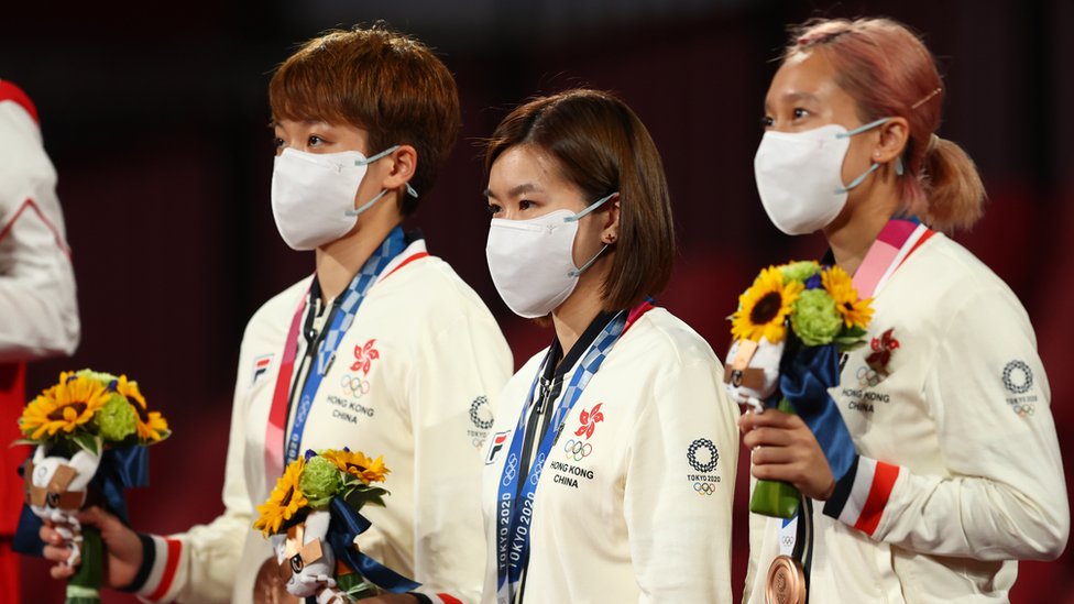 Bronze medallists Doo Hoi Kem of Hong Kong, Lee Ho Ching of Hong Kong and Soo Wai Yam Minnie of Hong Kong on the podium
