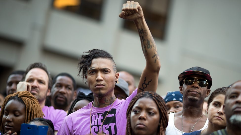 Colin Kaepernick supporters rally in protest at the LA Coliseum