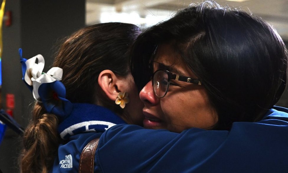 Nicaraguans celebrate the arrival of the group of those released at Dulles airport, in Virginia.