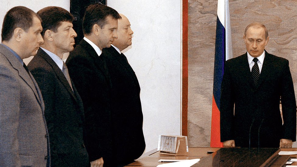 Putin and cabinet members observe a minute of silence in 2004 after the Beslan school siege