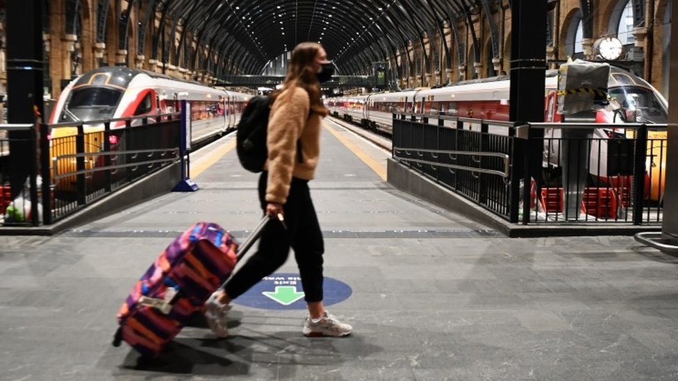 A commuter at Kings Cross Station in London