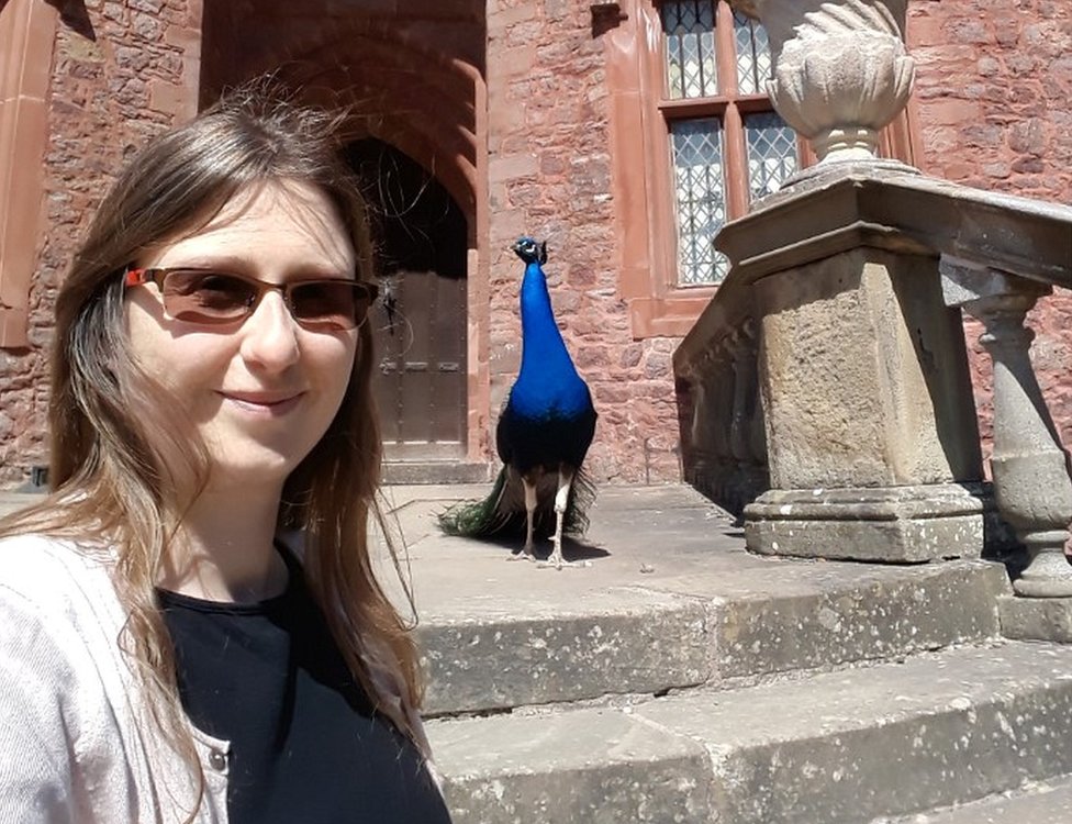 Sarah Johnson with a peacock