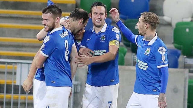 Linfield players celebrate one of the three goals they scored against Cliftonville