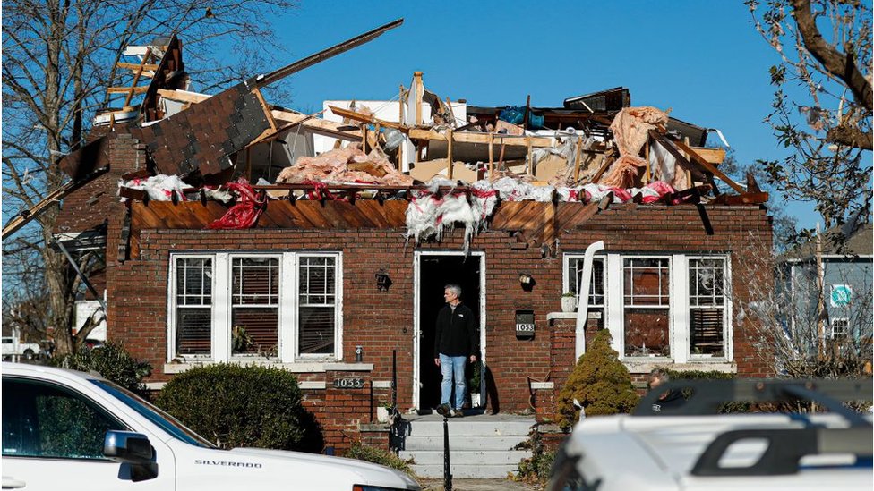 A man surveys damage in Bowling Green