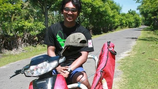 Aldi Haryopratomo on his motorbike