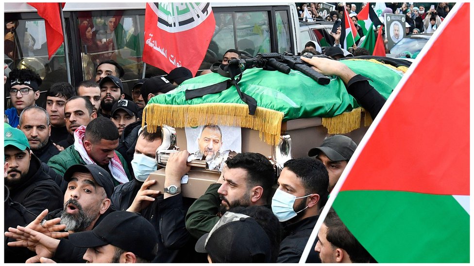 Mourners carry the coffin of Hamas deputy leader Saleh al-Arouri