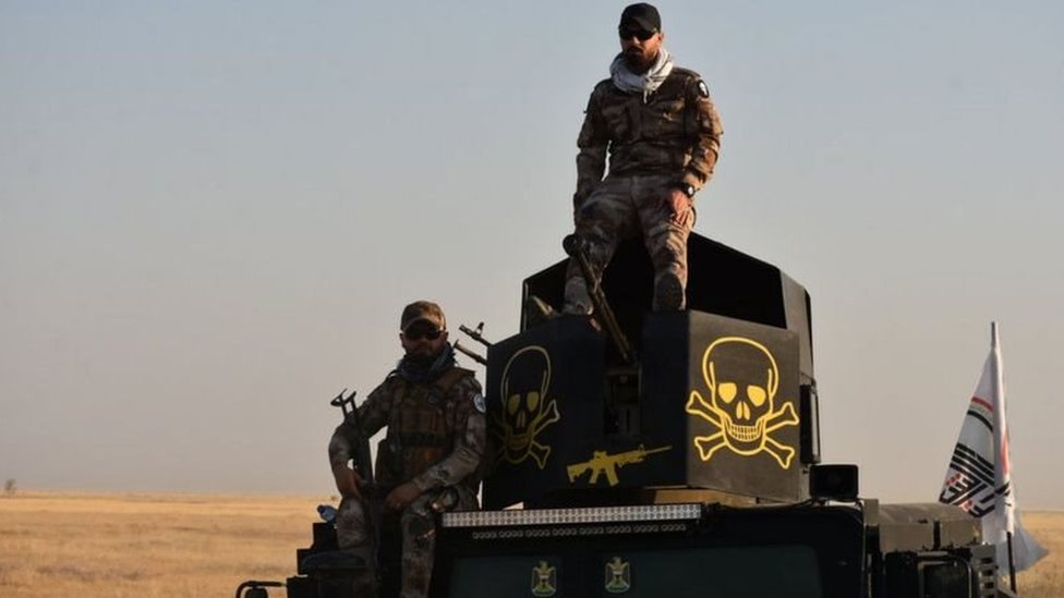 مسلحون تابعون لقوات الحشد الشعبي في العراق