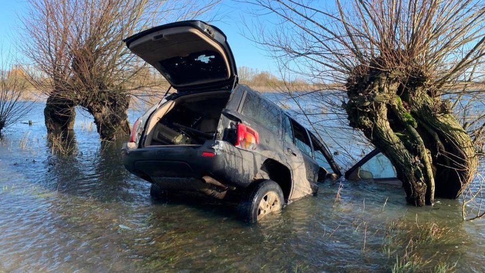 Cars abandoned on flooded Fens road by suspected hare coursers