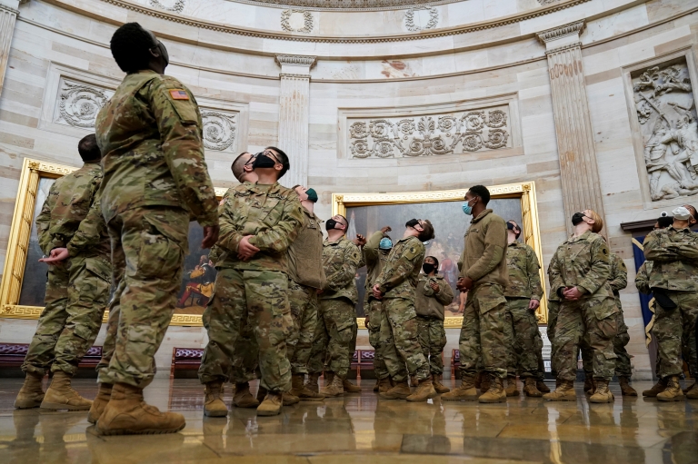 Soldiers stare up at ceiling of US Capitol building