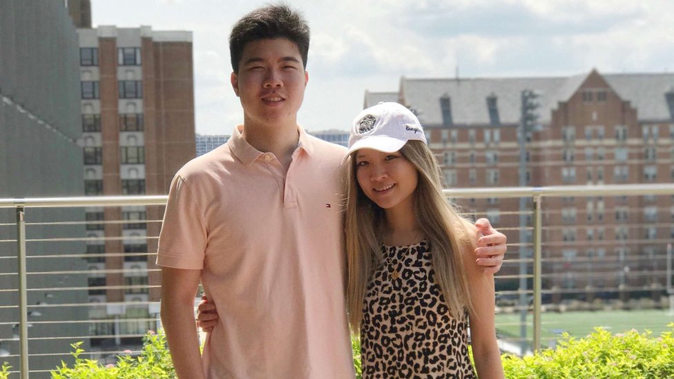 China defends holding fugitive businessman's US children