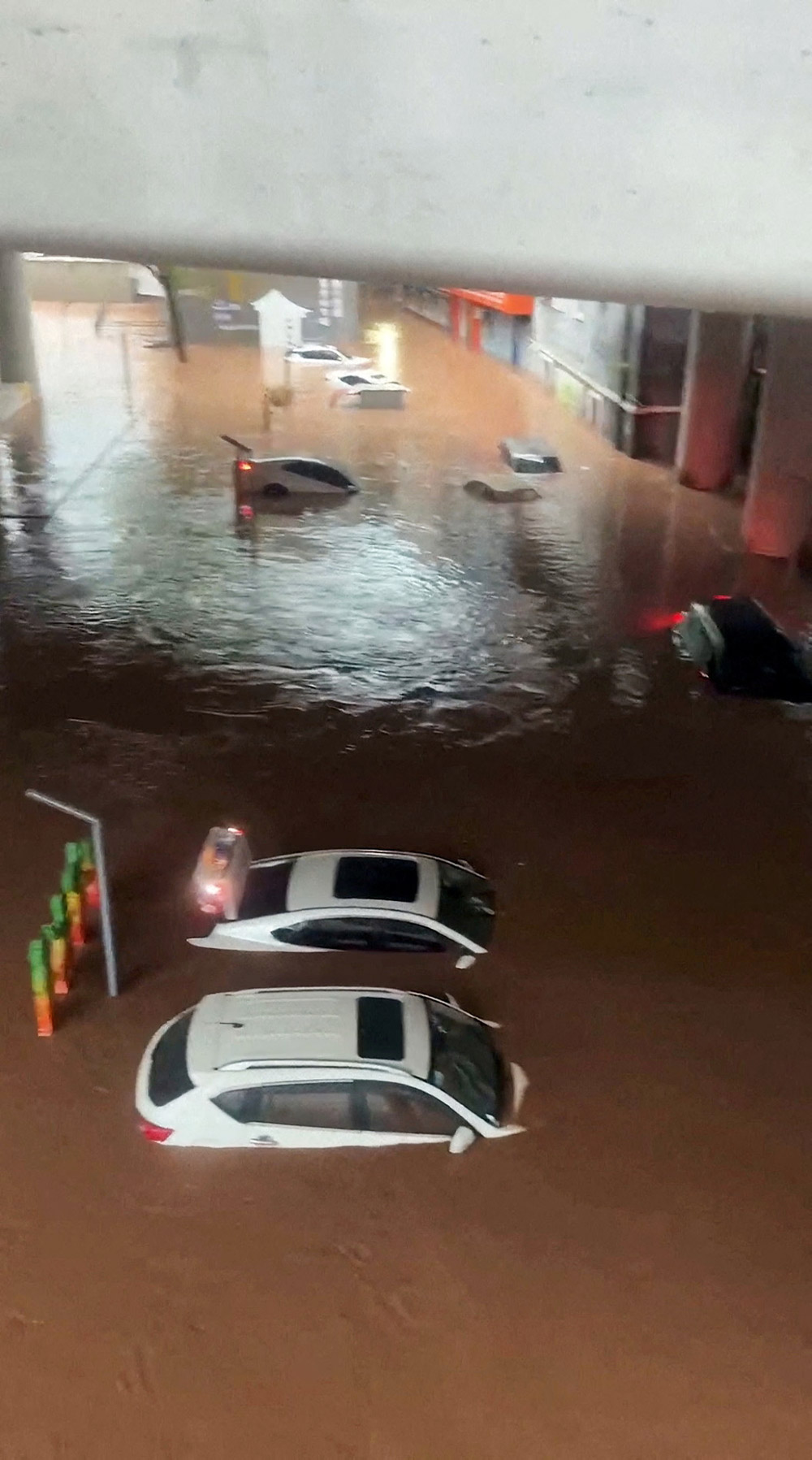 ​​A view of cars submerged in flood waters in Wanzhou district, Chongqing, China - 4 July 2023