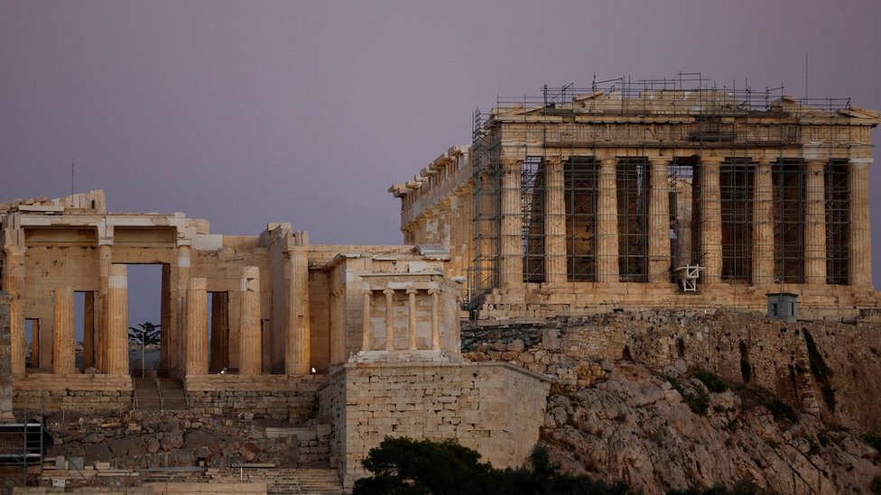 A view of the Parthenon temple ruins atop the Acropolis archaeological site in Athens, Greece