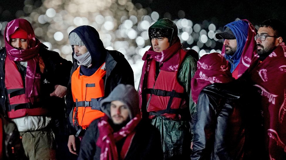 A group of people thought to be migrants are brought in to Dover, Kent, on 25 November 2021, after a small boat incident in the Channel in which 27 people died