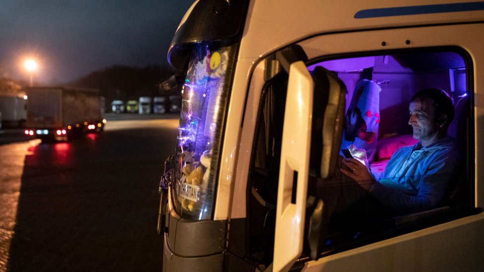 Romanian lorry driver Christian waits in his cab at Ashford lorry park on Monday night