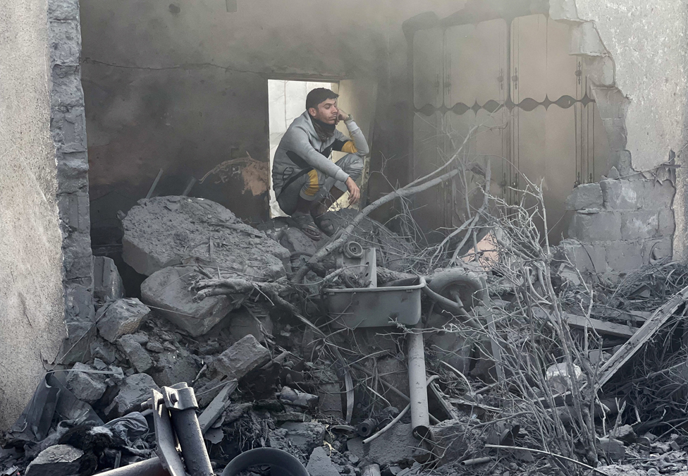 Man amid wreckage in Gaza