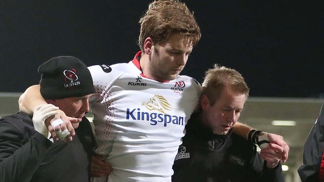 Iain Henderson requires assistance after suffering his hamstring injury