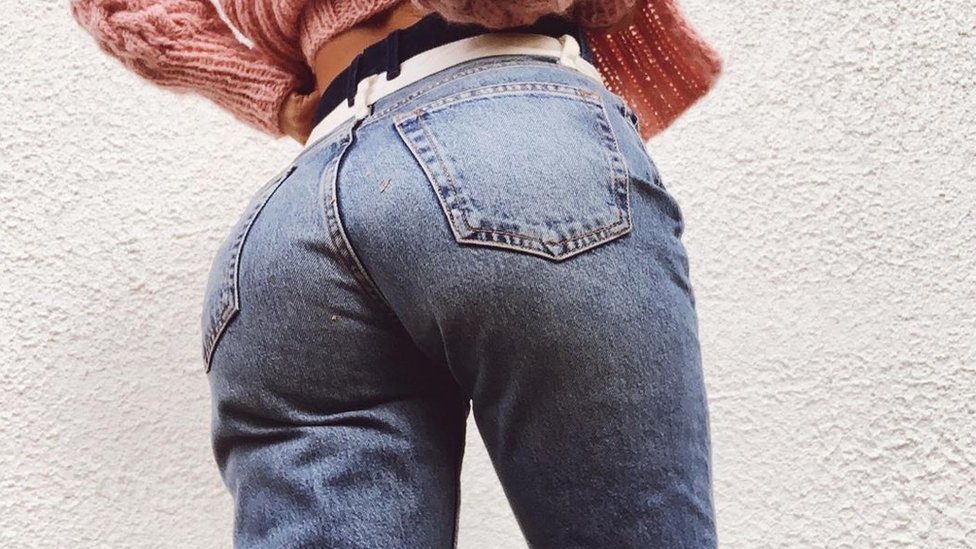 A picture of Sophie Elise wearing jeans