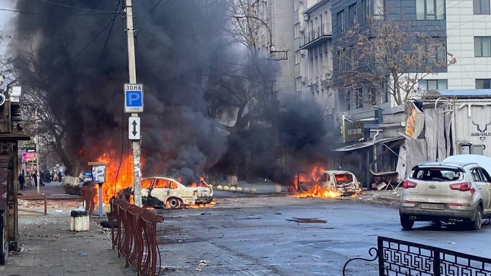 Cars burn on a street after a Russian military strike, amid Russia's attack of Ukraine, in Kherson, Ukraine (December 24, 2022)