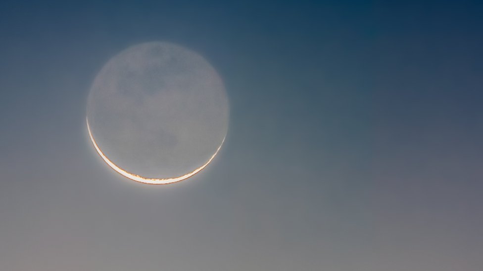 Crescent moon with the dark part of the Moon slightly illuminated by earthshine