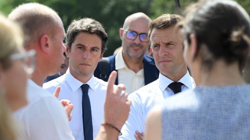 French President Emmanuel Macron (R) and French Education and Youth Minister Gabriel Attal (L) meet schoolchildren during his visit at the College Daniel Argote Middle School in Orthez, France, 05 September 2023