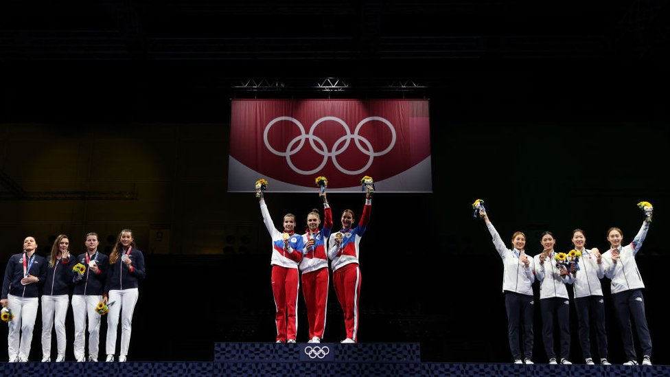 Gold medalists Team ROC pose on the podium during the medal ceremony for the during the Women's Sabre Team Fencing