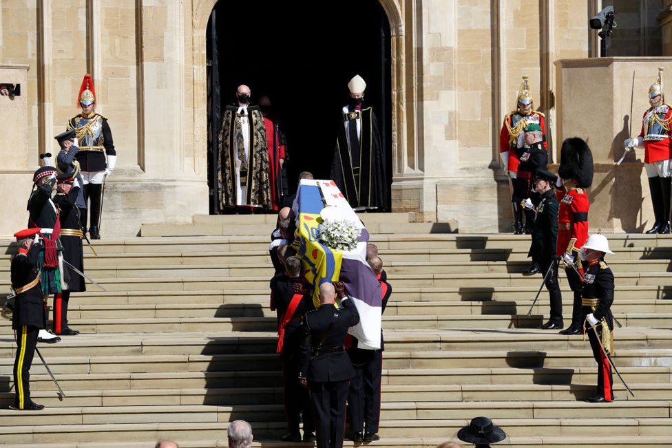 Duke of Edinburgh's coffin, covered with His Royal Highness's Personal Standard arrives at St George's Chapel carried by a bearer party found by the Royal Marines during the funeral of Prince Philip, Duke of Edinburgh at Windsor Castle on April 17, 2021 in Windsor, England.