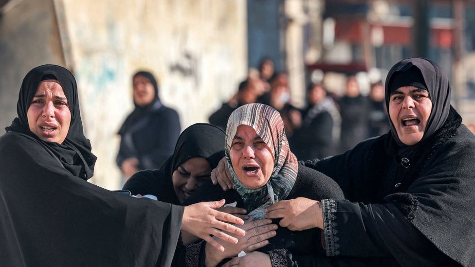 Women mourn the death of a relative in in Rafah in the southern Gaza Strip on 19 December, 2023