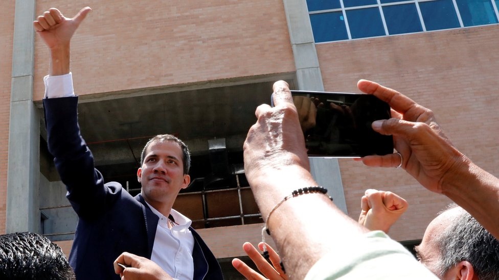 Venezuelan opposition leader Juan Guaidó greets supporters after his arrival at the Simon Bolivar International airport in Caracas, Venezuela March 4, 2019