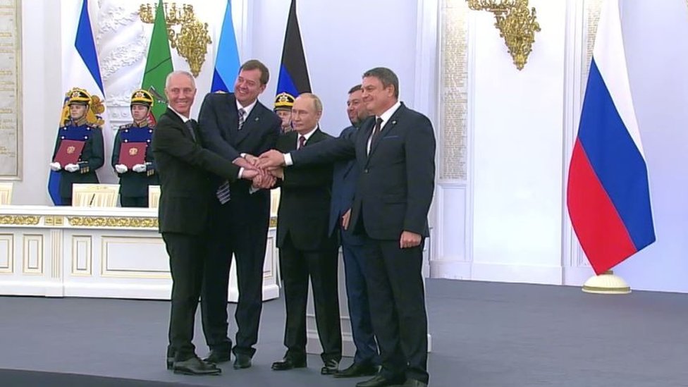 A screen grab form Kremlin shows the heads of 4 Ukrainian separatist regions Vladimir Saldo, Yevgeny Balitsky, Denis Pushilin, Leonid Pasechnik and Russian President Vladimir Putin